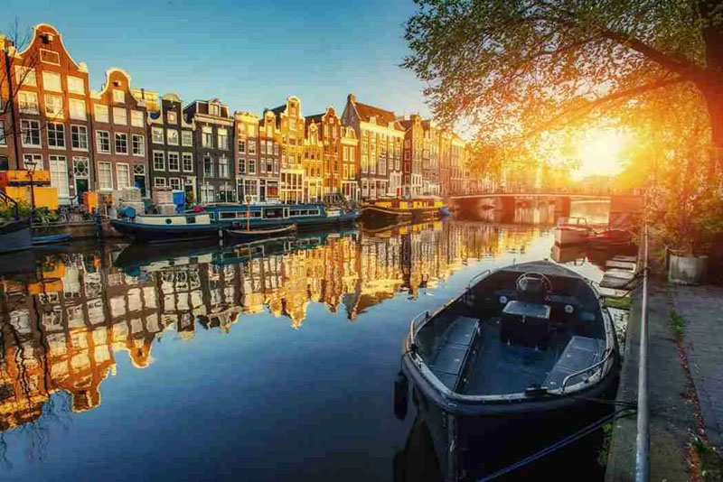 Canal with low sun and mirroring water